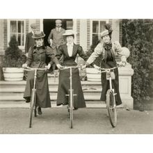 Three women on bicycles Wall Mural