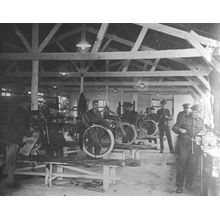 A WWI motorcycle repair shop Wall Mural
