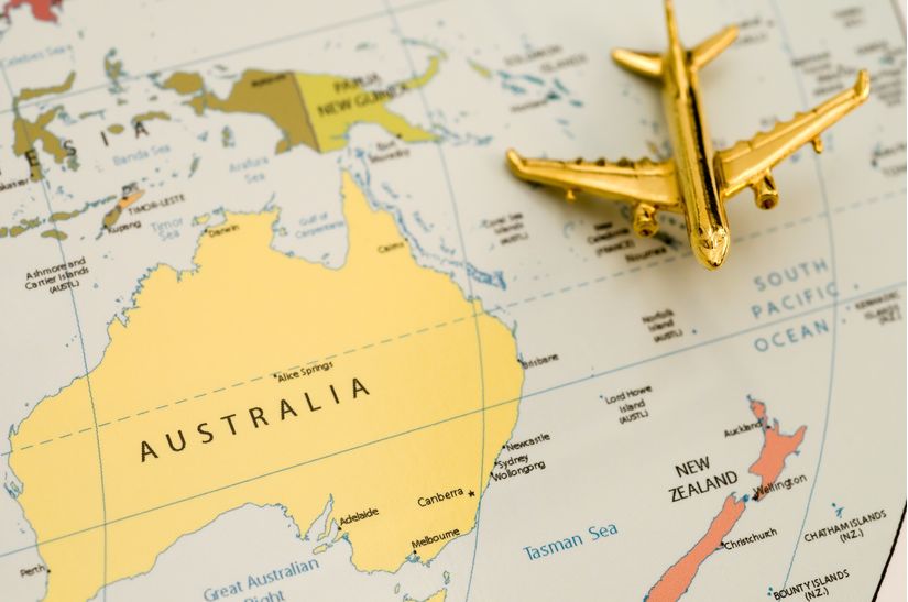 A-golden-plane-approaches-the-great-nation-of-Australia-on-a-world-map-