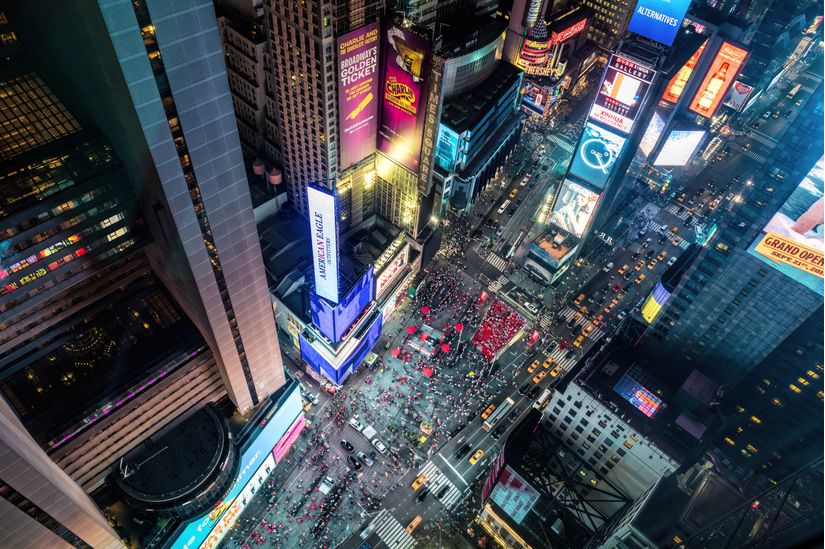 Times-Square-from-above-in-New-York-City-with-tall-buildings-and-skyscrapers-at-night