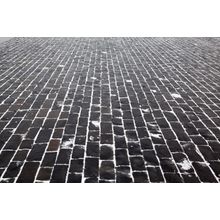 Close Up Cobblestone Pavement in Winter Time Wall Mural