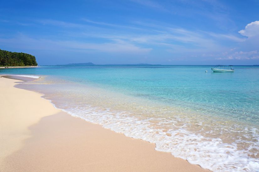 Crystal clear water of the tropical sea and white sand beach