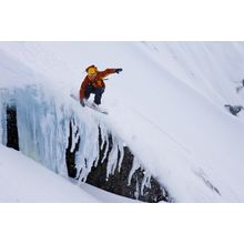 Snowboarding Over a Snowy Cliff Wall Mural