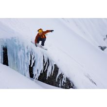 Snowboarding Over a Snowy Cliff Mural Wallpaper