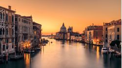 image captures the city’s iconic canals and rivers under a captivating sky during the sunrise