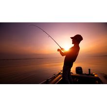 Young Man Fishing At Sunset Wall Mural