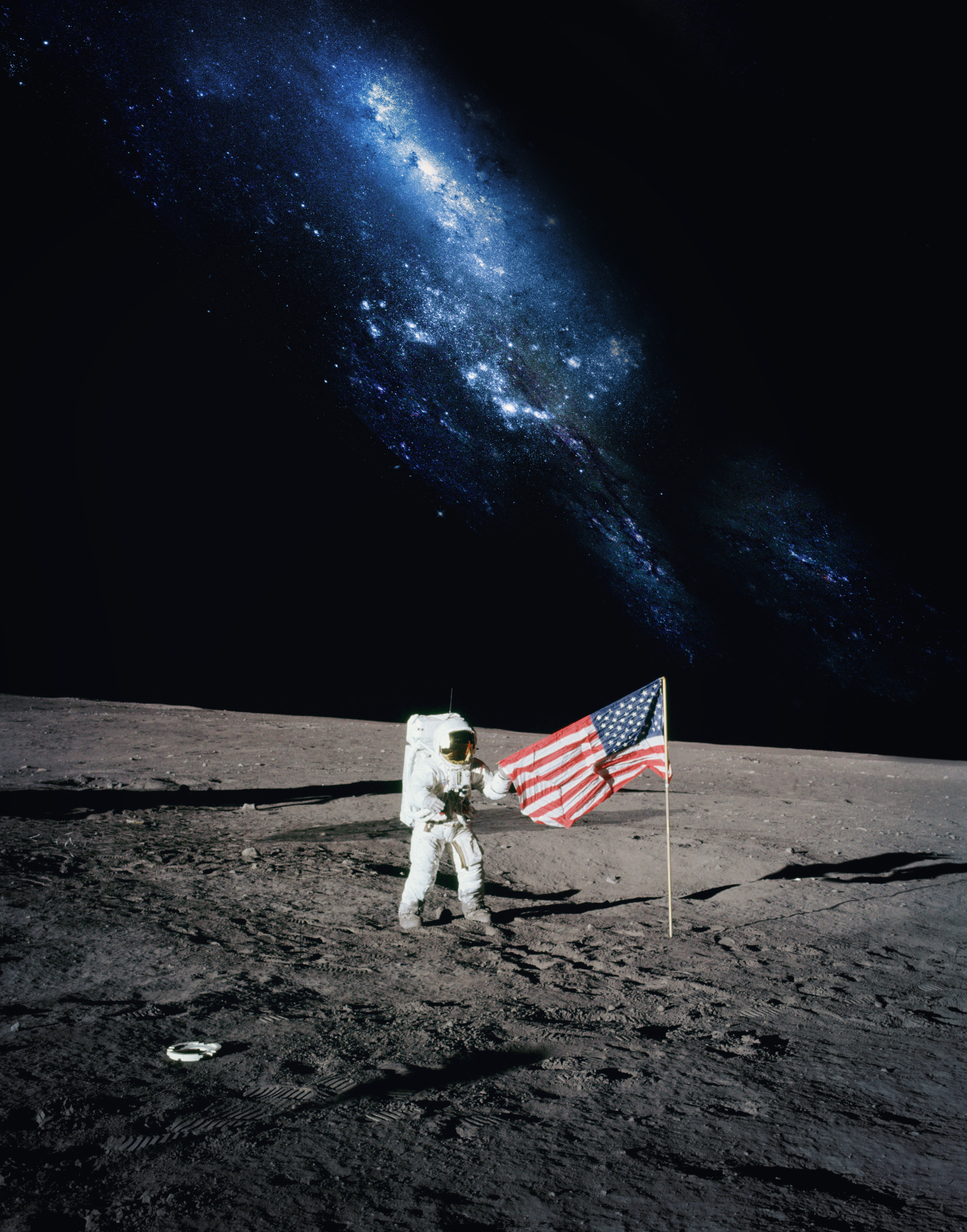 astronaut on moon by the american flag