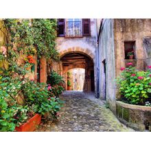 Arched Cobblestone Street In A Tuscan Village Italy Wallpaper Mural