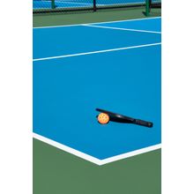 Pickleball Court With A Paddle And Orange Ball