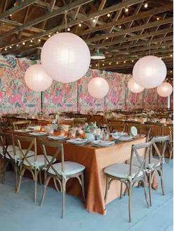 Pink-flower-mural-as-a-backdrop-to-a-wedding-reception