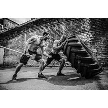 Muscular Fitness Man Moving Large Tire Wall Mural