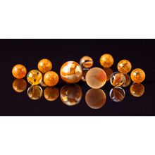 Marbles Reflected On Black Wall Mural