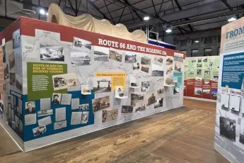 Extensive timeline wall mural with pictures and a map of route 66 at a museum