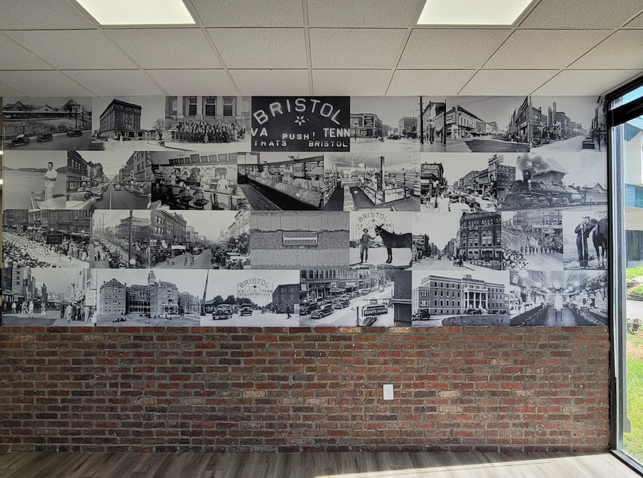 Historic bristol landmark vintage photo collage mural above partial brick wall