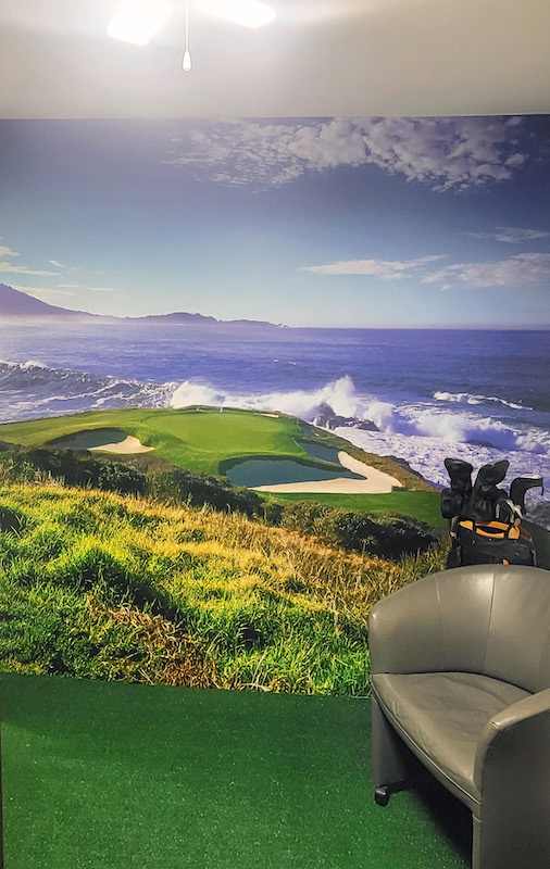 Pebble Beach golf course mural in a  in-home putting green
