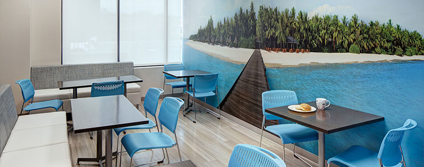 Cafeteria break room with island beach boardwalk mural