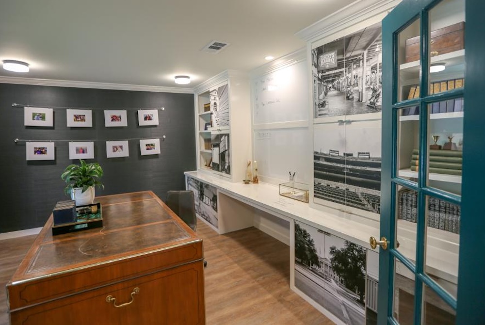 Library office with vintage landmark photos murals on built in cabinets