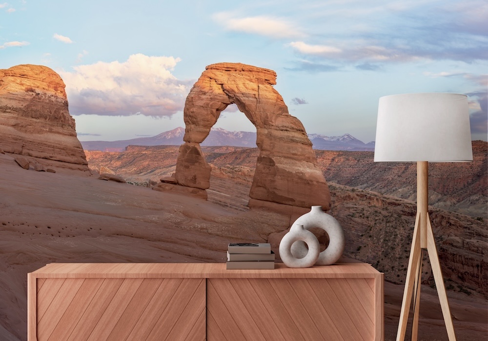 Wall mural of desert arches at sunset in a home setting