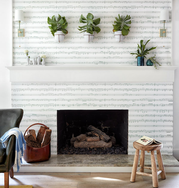 Custom sheet mural wallpaper surrounds a fireplace and mantel