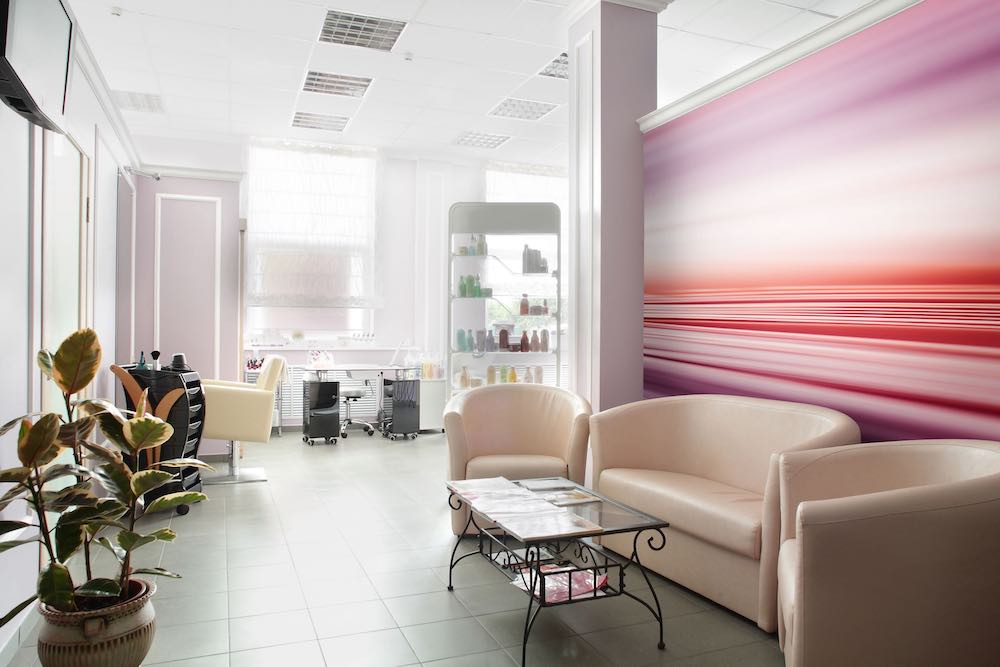 Striped Purple And Red Wallpaper on a wall of a waiting area in a salon