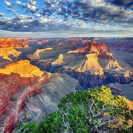 Sunrise washes over the cliffs of the Grand Canyon