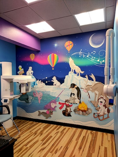 Arctic animal custom kids wall mural in pediatric medical office