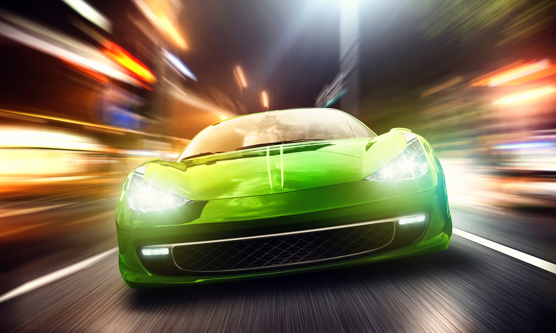 A green sports car speeding through city streets