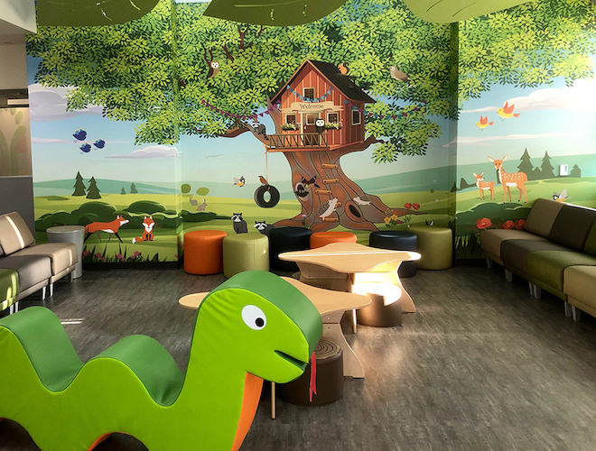 Tree house forest animal custom wall mural in pediatric lobby