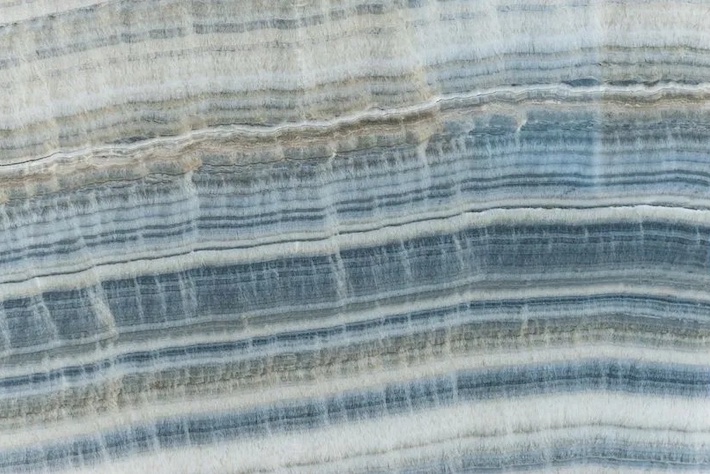 A close up slice of a blue gray granite