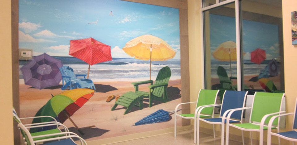 Beach Wall Mural of Colorful Chairs And Umbrellas In A Waiting Room