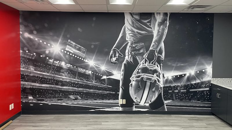 football player mural in Gameday Men's Health