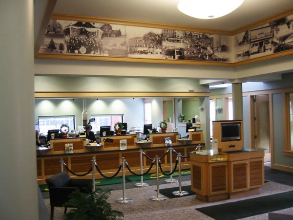 Black And White Historical Wall Mural In A Bank Above the Teller Windows