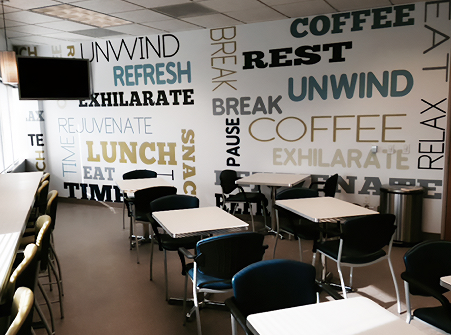 Coffee and relaxation themed word cloud mural in employee break room