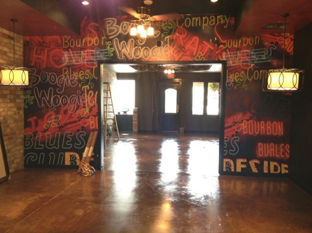 Neon sign mural in a bar