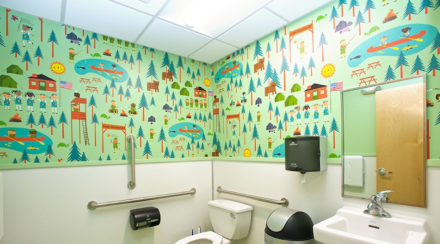 Custom summer camp illustration wall mural in pediatric bathroom