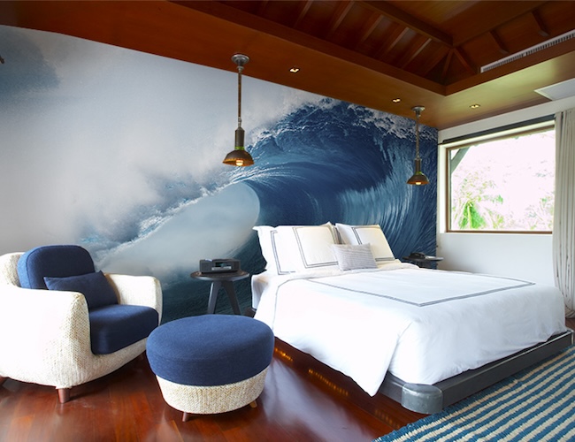 Mural of a huge wave in a  guest room