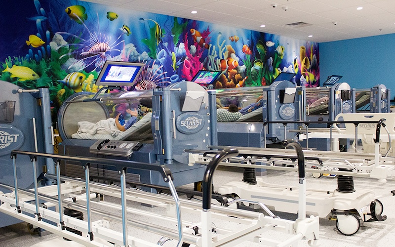 Pediatric medical center with fish coral reef panoramic wall mural