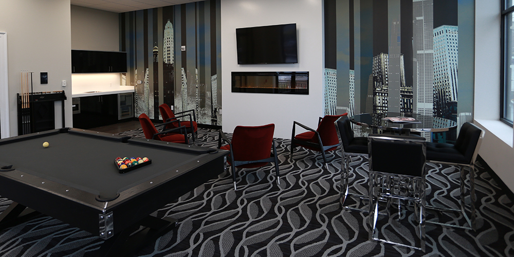 Abstract city skyline mural in a hotel game room