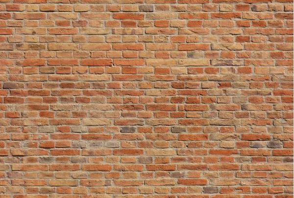 Faux brick mural in various shades of red and brownf 