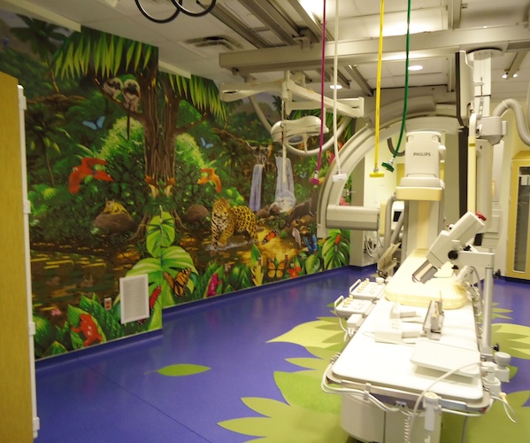 Rainforest jungle animal wall mural in pediatric xray room