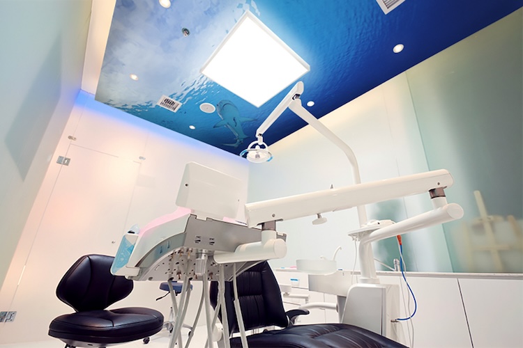 Dental exam room ceiling with underwater ocean shark photo mural