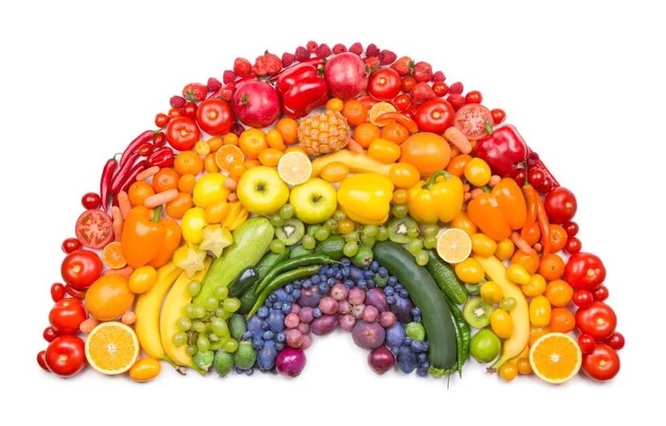 A rainbow created using fruits and vegetables