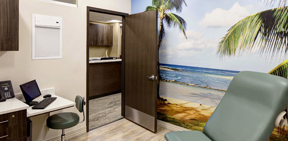 Beach Wall Mural With Waves And Palm Trees In A Doctors Office