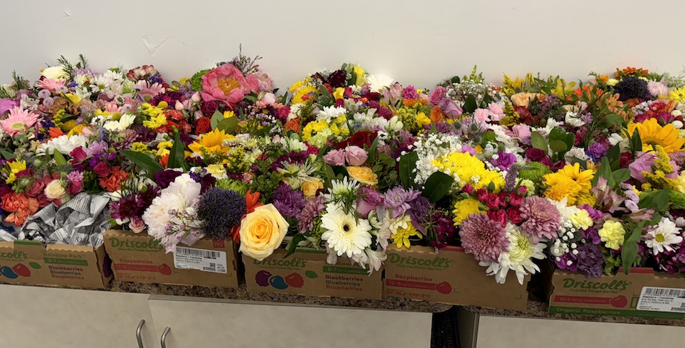 Boxes of flower arrangements ready for delivery