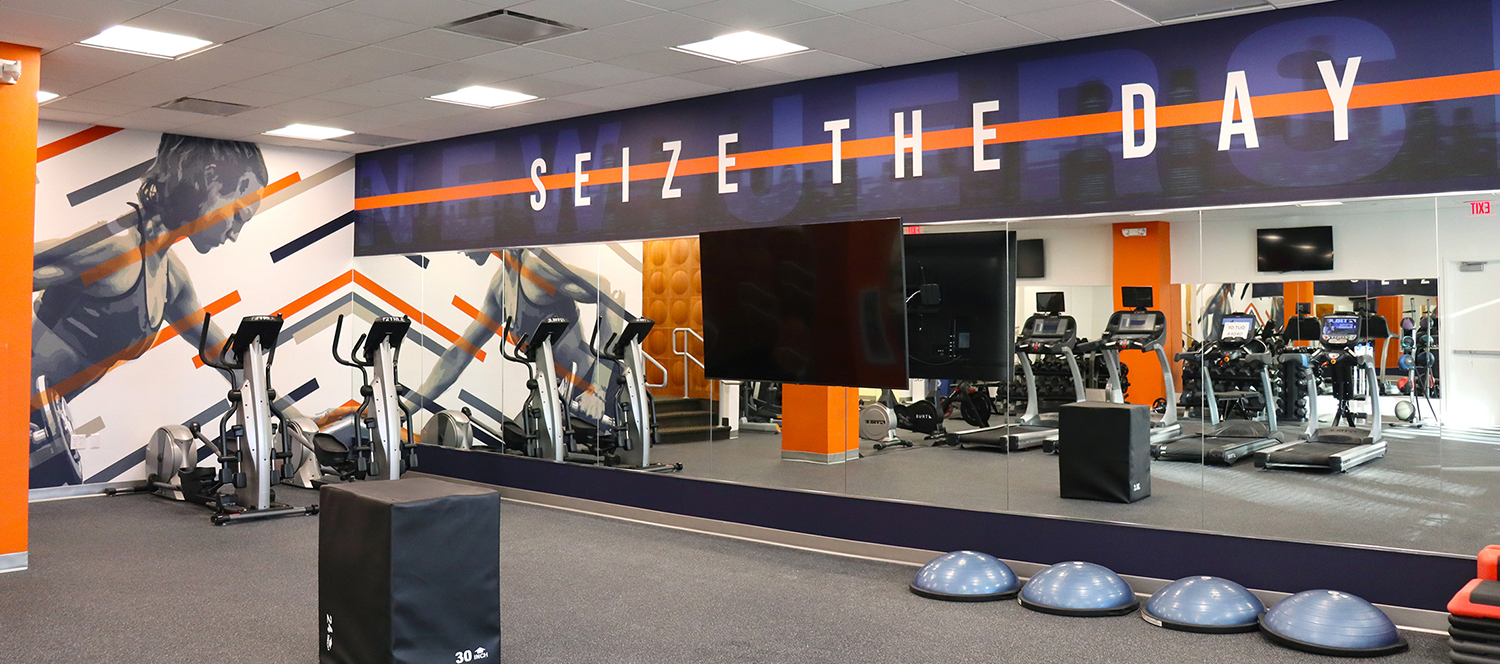 Bold custom murals in a hotel fitness room