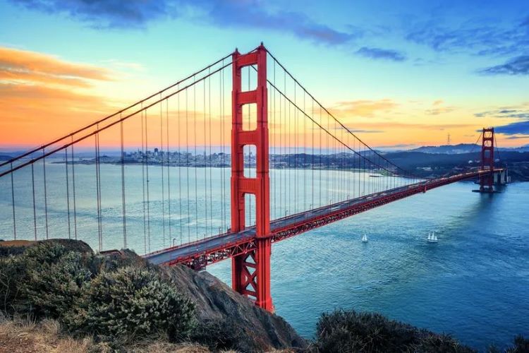 View of Golden Gate Bridge at sunset from the Marin Headlands