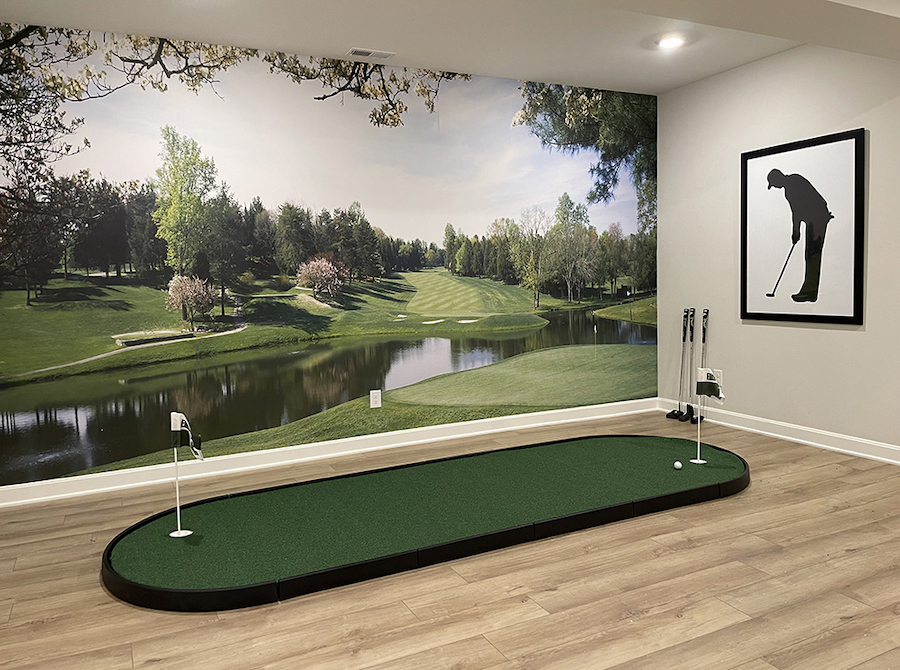 Country club golf course wall mural behind indoor putting green 